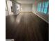 Living room boasts natural light from bright windows and hardwood floors at 276 Colewood Nw Way, Atlanta, GA 30328
