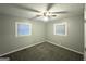 Inviting bedroom with a ceiling fan and two bright windows allowing natural light at 3645 Croft Nw Pl, Atlanta, GA 30331