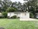Cozy brick home with inviting front lawn surrounded by lush trees at 3645 Croft Nw Pl, Atlanta, GA 30331