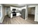 Modern kitchen with stainless steel appliances, granite countertops and stylish flooring at 3645 Croft Nw Pl, Atlanta, GA 30331
