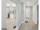 Hallway leading to a bright, open kitchen with modern appliances and stylish accents at 1515 Jonesboro Se Rd, Atlanta, GA 30315