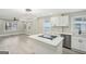 Open kitchen with quartz countertops, stainless steel appliances, and a large island at 1515 Jonesboro Se Rd, Atlanta, GA 30315