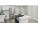 Bright, modern kitchen with white cabinets, stainless steel appliances, and white marble countertops at 1515 Jonesboro Se Rd, Atlanta, GA 30315