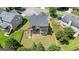 Beautiful backyard featuring a well-kept lawn, trees, and a wooden fence providing privacy at 6665 Flagstone Ct # 918, Cumming, GA 30028