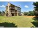 Large, grassy backyard with multi-level deck and home at 6665 Flagstone Ct # 918, Cumming, GA 30028