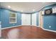 Finished basement with wood floors and bonus dart board at 6665 Flagstone Ct # 918, Cumming, GA 30028