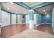 Finished basement has wood floors and blue walls at 6665 Flagstone Ct # 918, Cumming, GA 30028