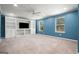 Finished basement features built-in shelving and large windows at 6665 Flagstone Ct # 918, Cumming, GA 30028