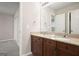 Bathroom boasting a double sink vanity with granite countertops and wood cabinets at 6665 Flagstone Ct # 918, Cumming, GA 30028