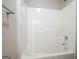 Bathroom showing a tub and shower combination with white tile surround at 6665 Flagstone Ct # 918, Cumming, GA 30028