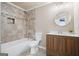 Bathroom with vanity, toilet, bathtub with tile surround at 6665 Flagstone Ct # 918, Cumming, GA 30028