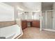 Bathroom showcasing a large tub, shower, and -and- vanity at 6665 Flagstone Ct # 918, Cumming, GA 30028