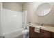 Bathroom with a shower-tub combo, single sink vanity, granite countertop, and modern fixtures at 6665 Flagstone Ct # 918, Cumming, GA 30028