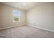Neutral bedroom with carpet, a window and a ceiling fan at 6665 Flagstone Ct # 918, Cumming, GA 30028