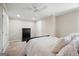 Bedroom with neutral walls and carpet, white trim and ceiling fan at 6665 Flagstone Ct # 918, Cumming, GA 30028