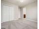 Bedroom featuring neutral walls, carpet floors and an entry to the ensuite bathroom at 6665 Flagstone Ct # 918, Cumming, GA 30028