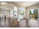 Spacious living room and dining area with wood floors and access to outdoor deck at 6665 Flagstone Ct # 918, Cumming, GA 30028