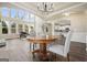 Open-concept living area with high windows, hardwood floors, and a view of the kitchen at 6665 Flagstone Ct # 918, Cumming, GA 30028