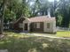 Classic brick home featuring a well-manicured lawn, quaint design and accessible ramp at 718 N Hairston Rd, Stone Mountain, GA 30083
