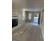 Living room featuring a white brick fireplace, neutral walls and plush carpeting at 718 N Hairston Rd, Stone Mountain, GA 30083