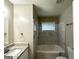 Bright bathroom featuring a granite vanity, shower-tub combo, updated fixtures, and a modern aesthetic at 2644 Connally Dr, East Point, GA 30344