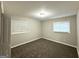 Comfortable bedroom featuring soft carpeting, neutral walls, and a window for natural light at 2644 Connally Dr, East Point, GA 30344