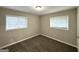 Comfortable bedroom with neutral walls, plush carpet, and natural light streaming through the windows at 2644 Connally Dr, East Point, GA 30344