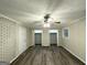 Large bedroom featuring wood floors, large closets, neutral paint, and a ceiling fan at 2644 Connally Dr, East Point, GA 30344