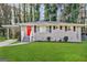 Charming brick home with a bright red door, well-manicured lawn, and inviting curb appeal at 2644 Connally Dr, East Point, GA 30344