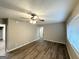 Spacious living room featuring hardwood floors, neutral paint, ceiling fan, and natural light at 2644 Connally Dr, East Point, GA 30344