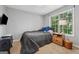 Cozy bedroom with a large window, plush carpet, and natural light at 1535 Smoke Hill Dr, Hoschton, GA 30548