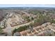 Aerial view shows a residential community with well-designed homes, lush greenery, and convenient road access at 2126 Roberts View Trl, Buford, GA 30519
