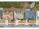 An aerial view shows the rooftops of neighboring houses and well-maintained yards at 2126 Roberts View Trl, Buford, GA 30519