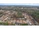 Discover a peaceful neighborhood from above, complete with charming homes, mature trees, and well-kept landscaping at 2126 Roberts View Trl, Buford, GA 30519