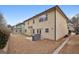 A spacious backyard with a covered grill, patio, and view of neighboring home at 2126 Roberts View Trl, Buford, GA 30519