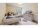 Comfortable bedroom with toys, plushies, and a window at 2126 Roberts View Trl, Buford, GA 30519