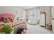 Cozy bedroom featuring a strawberry-themed bedspread and a plush beanbag chair, perfect for a space at 2126 Roberts View Trl, Buford, GA 30519