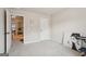 A carpeted room featuring a view of the hallway and closet with a door at 2126 Roberts View Trl, Buford, GA 30519