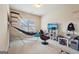 Spacious bedroom with a basketball hoop game, TV and gaming chair at 2126 Roberts View Trl, Buford, GA 30519