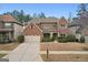 Beautiful two-story brick home with a manicured lawn and attached two-car garage at 2126 Roberts View Trl, Buford, GA 30519
