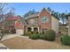 Lovely two-story brick home with landscaped yard and attached two-car garage at 2126 Roberts View Trl, Buford, GA 30519