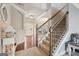 Grand foyer with hardwood floors, staircase, and arched doorways, offering a welcoming entrance at 2126 Roberts View Trl, Buford, GA 30519