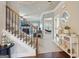 Entry foyer featuring hardwood floors, a staircase, and glimpses into the living room and hammock room at 2126 Roberts View Trl, Buford, GA 30519