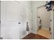 Hallway with a view of a laundry room with a washer and dryer at 2126 Roberts View Trl, Buford, GA 30519