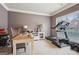 A home office features neutral walls, white trim, and a treadmill at 2126 Roberts View Trl, Buford, GA 30519