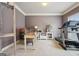 A home office features neutral walls, white trim, and a treadmill at 2126 Roberts View Trl, Buford, GA 30519