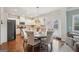 Bright kitchen with white cabinetry, stainless steel appliances, and a breakfast nook at 2126 Roberts View Trl, Buford, GA 30519