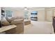 Upstairs bonus room featuring plush seating and a wall-mounted television at 2126 Roberts View Trl, Buford, GA 30519