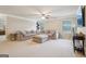 Upstairs living area with generous seating, carpet floors, and ample natural light at 2126 Roberts View Trl, Buford, GA 30519