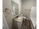 Clean bathroom with granite countertop sink, white tile shower and wood look floor at 4329 Parkview Dr, Lithia Springs, GA 30122